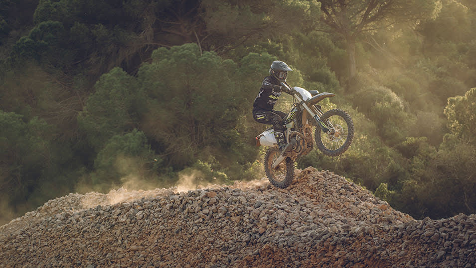Triumph TF 450-E riding shot on rocky hills